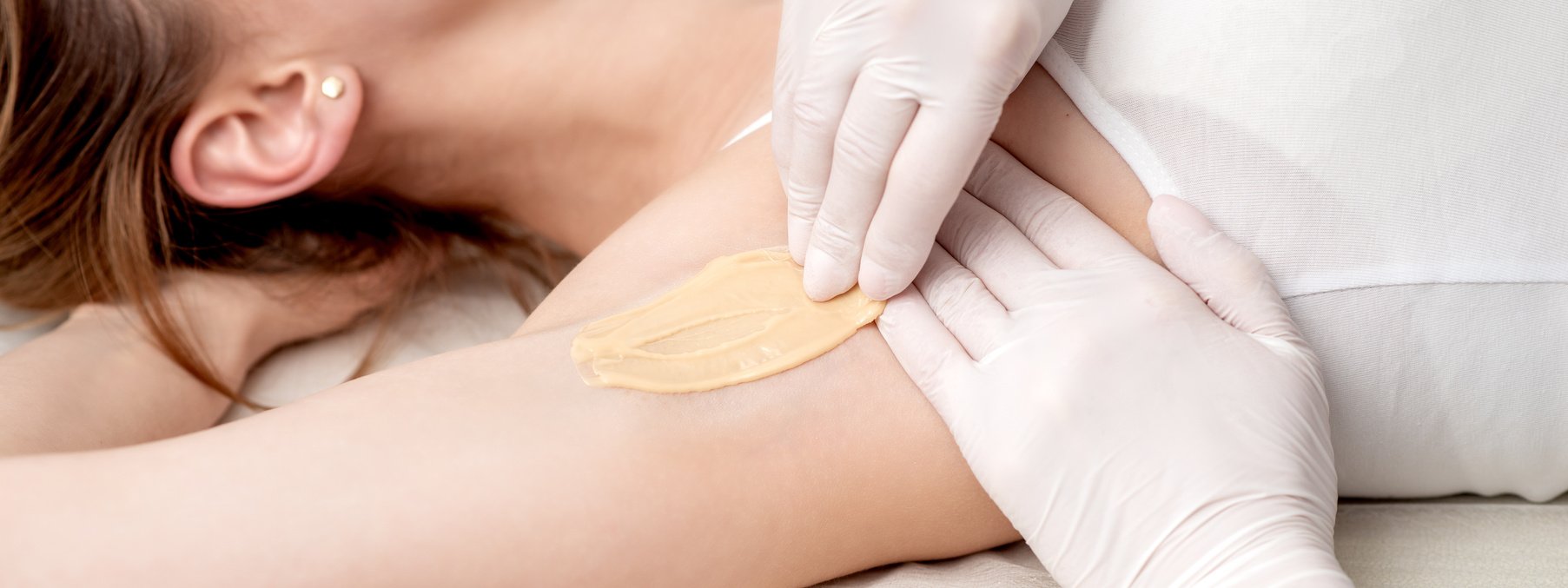 Cosmetologist Applying Wax Paste on Armpit